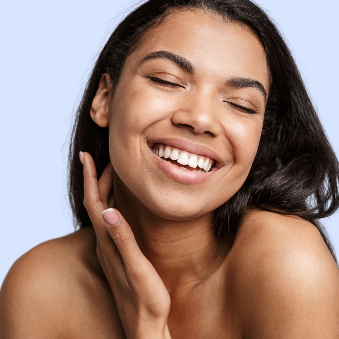 smiling woman touching face 